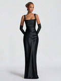 Front view of olive satin mermaid gown styled in a lounge with evening decor