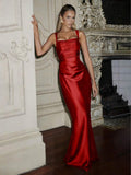 Front view of burgundy satin dress with square neckline styled with matching long gloves