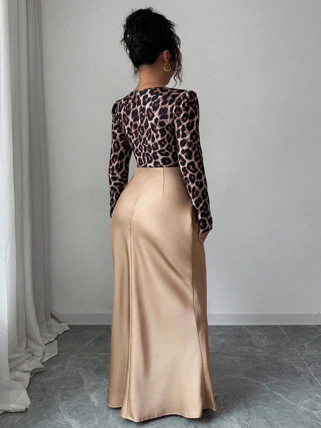 Turn heads at your next soirée in this stunning leopard print satin bodycon dress. The luxe turtleneck keeps things sophisticated while the dramatic fishtail hem adds a flirty twist that'll have everyone asking where you got your look. Crafted for curves, this plus-size beauty hugs you in all the right places with a silky-smooth finish that screams elegance. Whether you're hitting a cocktail party or a night out with the girls, this dress is your secret weapon for looking absolutely fabulous.