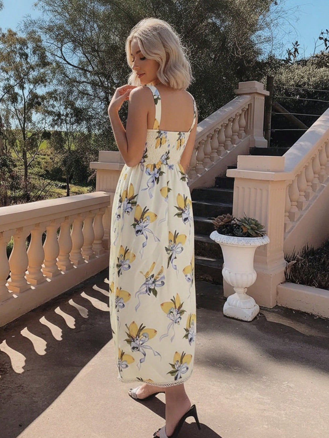 Brighten your summer wardrobe with this delightful bohemian maxi dress, featuring a cheerful lemon print that brings instant joy to any occasion. The charming square neckline offers a flattering, modern silhouette, while the playful ruffle hem adds a whimsical touch that dances with every step. Perfect for beach days, garden parties, or casual adventures, this dress combines comfort with effortless style. The flowing fabric keeps you cool and breezy, making it an ideal choice for warm-weather dressing. Embr