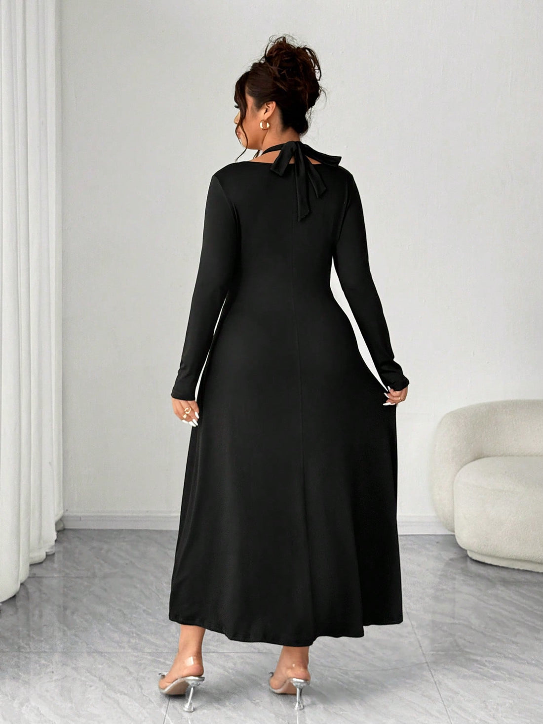 Embrace effortless elegance with this plus-size knit dress that's basically a hug from your closet. The flattering V-neckline and strategic ruching create a silhouette that feels as good as it looks, while the tie-front detail adds a playful twist. Crafted in soft, cozy knit fabric perfect for autumn and winter, this solid-color stunner transitions seamlessly from casual coffee dates to dinner plans. It's the dress that makes you feel confident, comfortable, and undeniably chic—no complicated styling requir