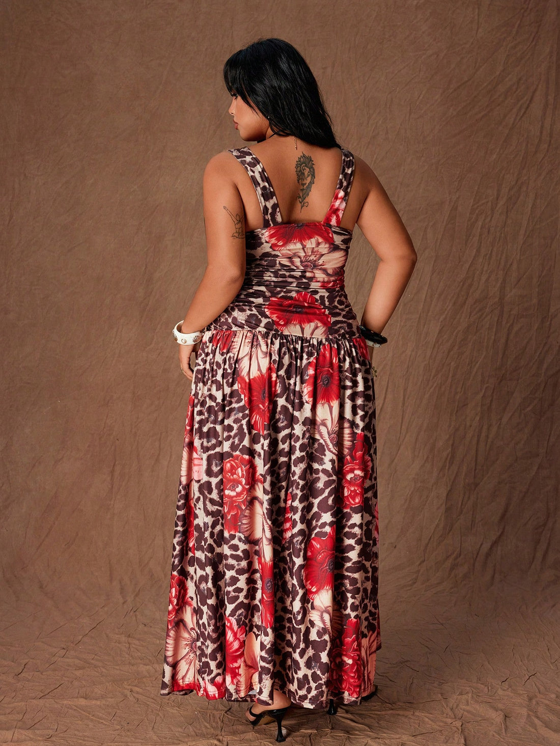 Turn heads on your next getaway in this bold leopard print dress designed for curves and confidence. The daring backless silhouette and strategic hollow-out details create an undeniably sexy vibe, while the soft polyester fabric moves beautifully with you. Perfect for beach days, resort dinners, or anywhere you want to make a statement. Embrace your style and own every moment in this vacation essential that celebrates your body.