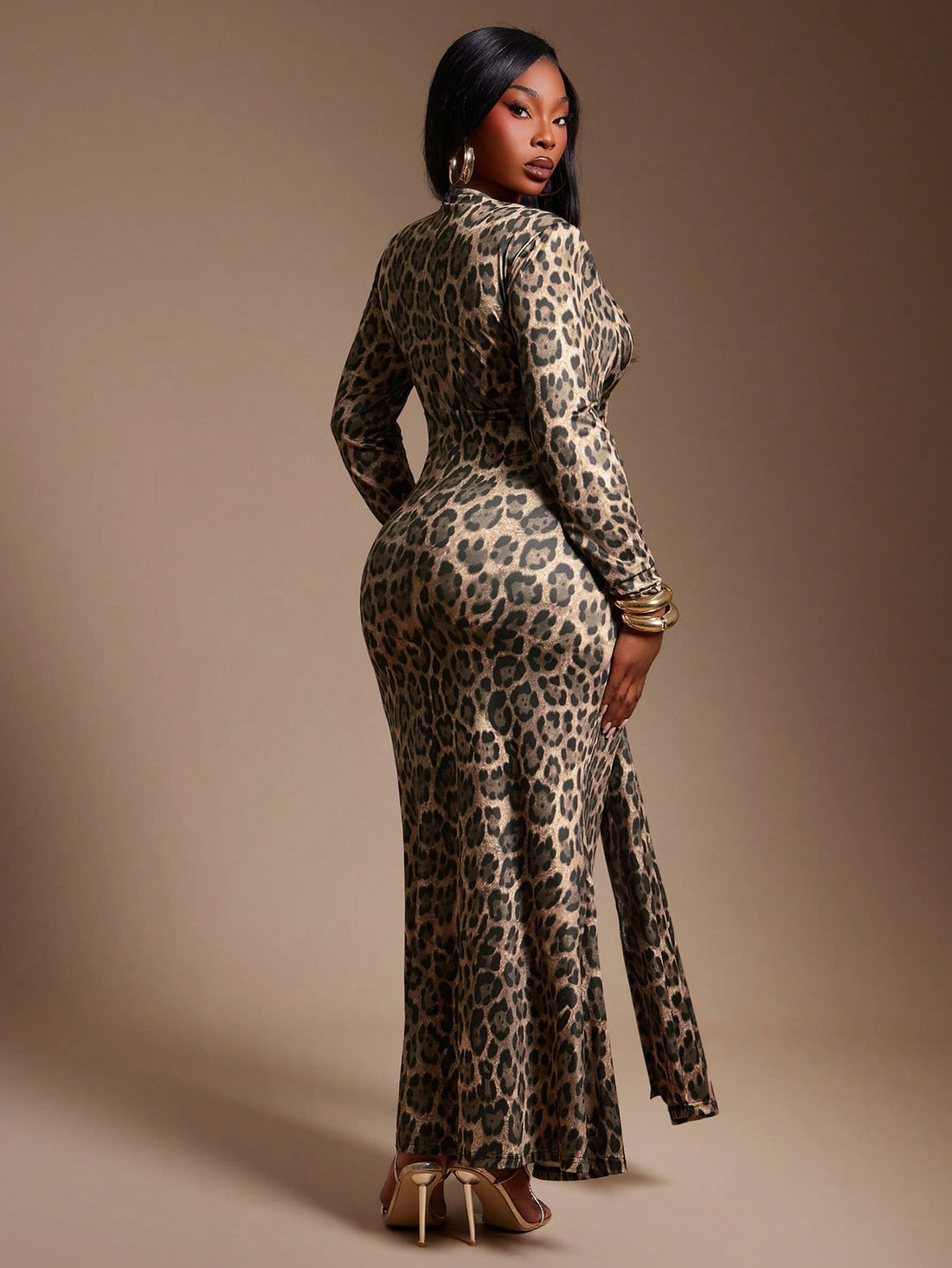 Unleash your wild side this autumn with our stunning leopard print dress—the perfect blend of bold style and effortless elegance. Designed for the modern plus-size woman, this long-sleeve beauty features a daring deep V neckline and a thigh-high slit that commands attention. Whether you're jet-setting on vacation or turning heads at dinner, this versatile piece transitions seamlessly from day to night. The timeless leopard pattern pairs beautifully with everything in your wardrobe, while the flattering silh