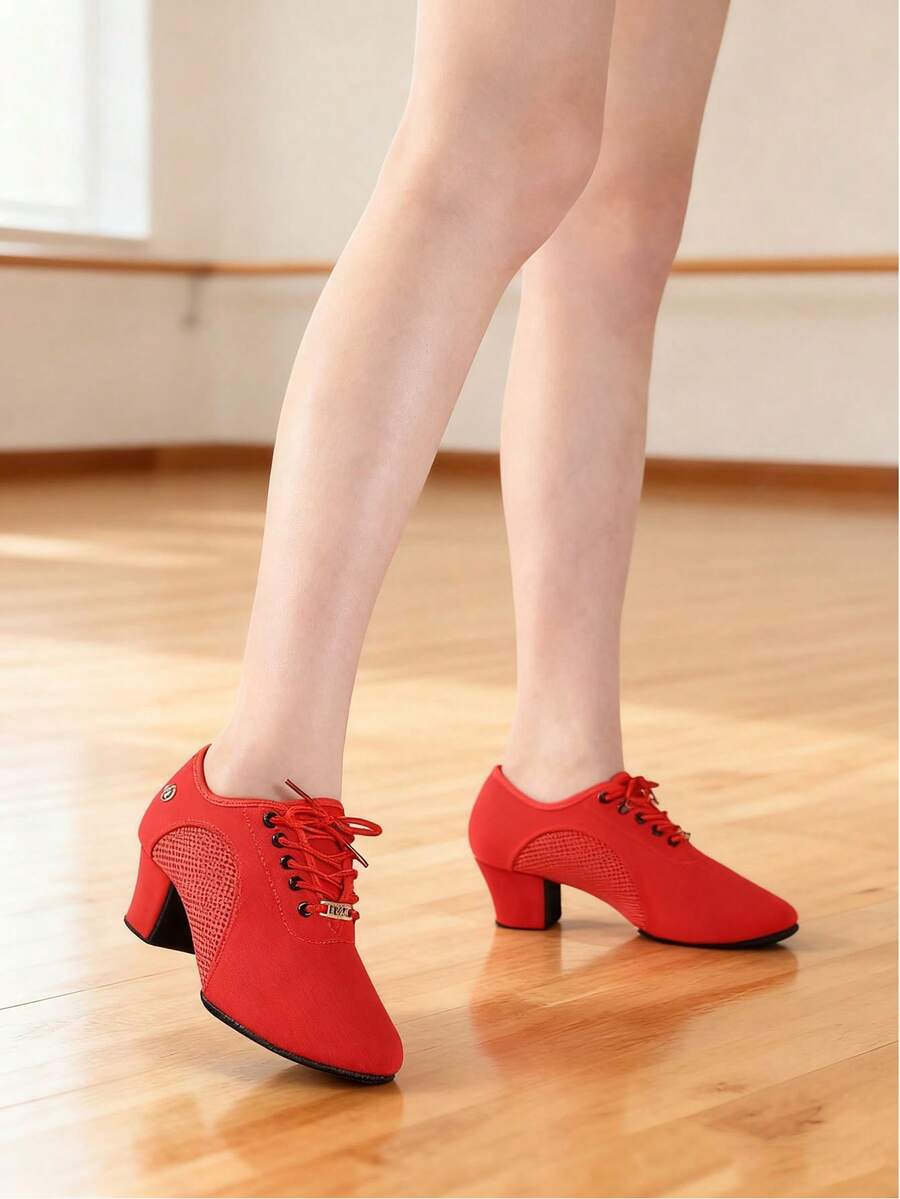 Step into elegance with these stunning red ballroom dance shoes designed for women who demand both style and performance. Featuring a comfortable 5 cm mid heel and supportive ankle strap, these shoes provide the stability needed for smooth, controlled movements on the dance floor. The round toe design offers a classic silhouette, while premium PU leather uppers deliver durability and a polished finish. With a suedette outsole for optimal grip and fabric lining for breathability, these indoor dance shoes com