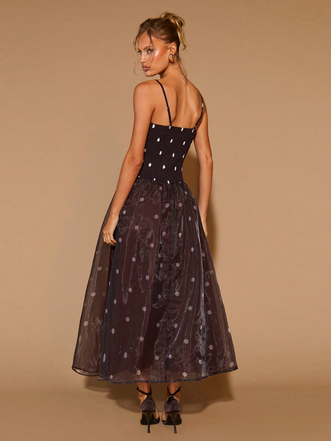 Twirl into romance with this charming polka dot slip dress! The flattering A-line silhouette skims your curves beautifully, while the midi length keeps things sophisticated yet flirty. Perfect for Valentine's Day dates, cocktail parties, or any occasion calling for effortless elegance. The classic polka dot pattern adds a touch of vintage-inspired fun that never goes out of style. Slip it on and let the compliments flow!