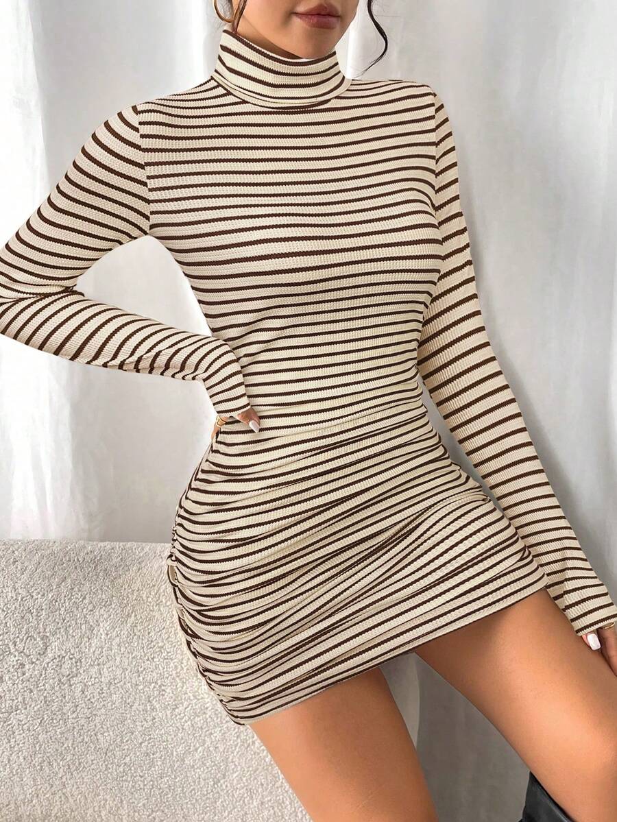 Side view of ruched bodycon sweater dress in cream and dark brown stripes