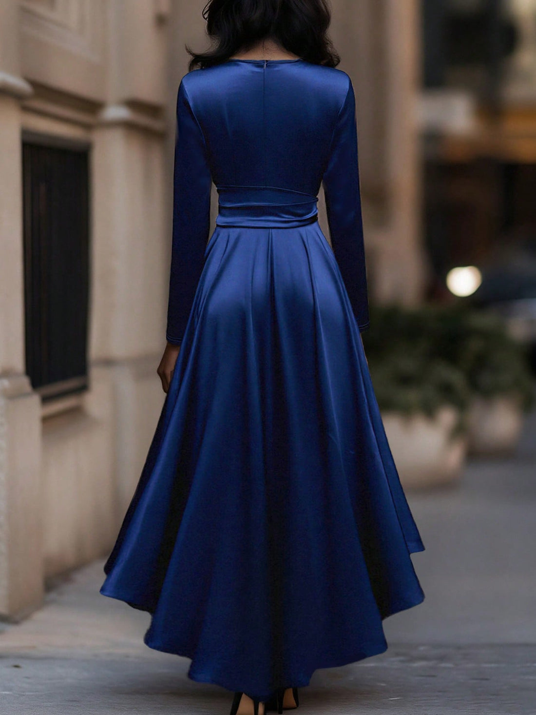 Elevate your seasonal wardrobe with this stunning V-neck dress that's equal parts sophisticated and fun! The graceful layered pleats create beautiful movement, while the asymmetrical ruffle hem adds an unexpected twist of playfulness. Cinch it at the waist with the tie detail to define your silhouette, then let the flowing length carry you through autumn and winter in style. Perfect for dressing up or down, this piece proves that elegance doesn't have to be boring.