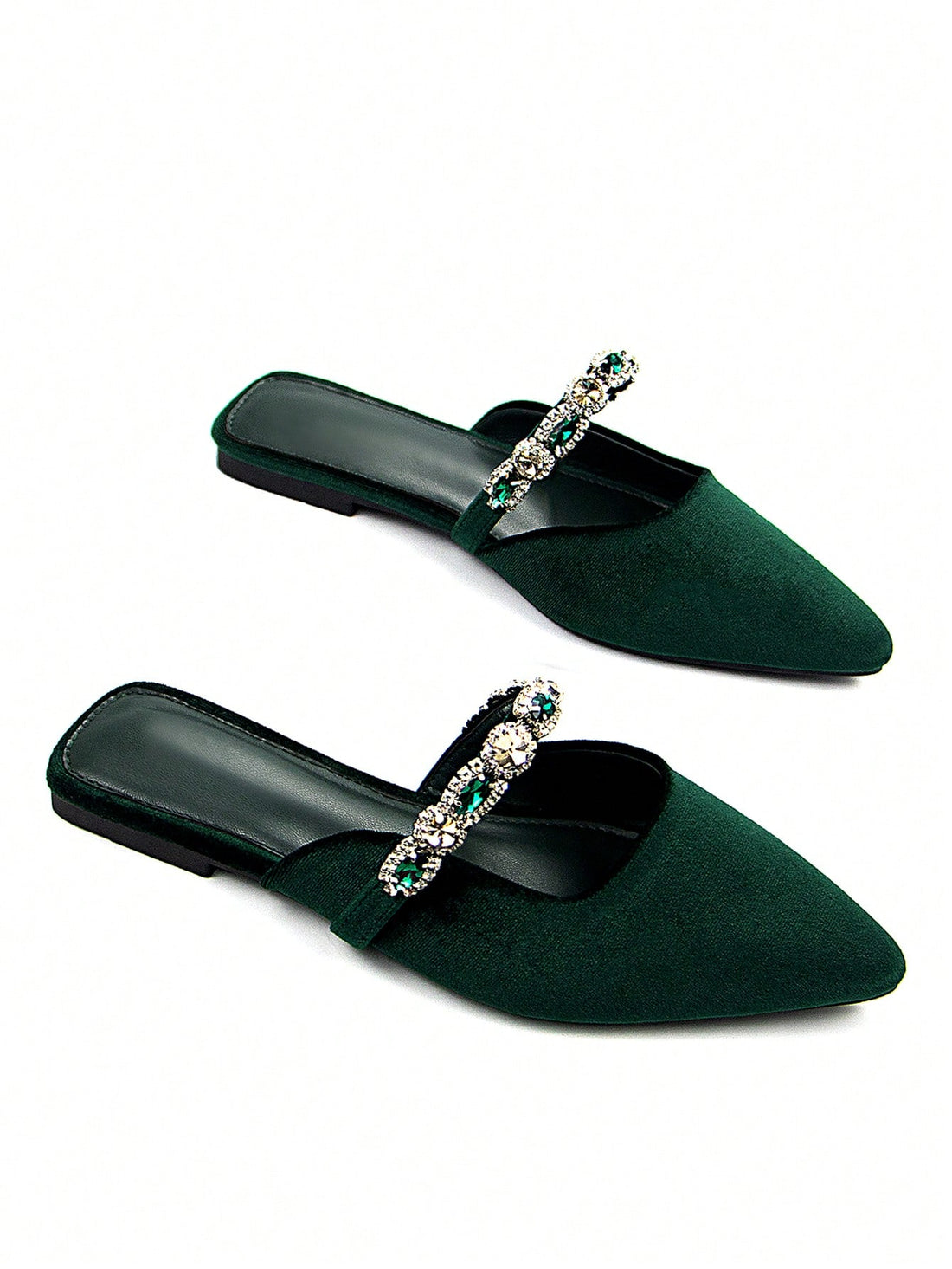 Elevate your footwear collection with these sophisticated velvet mules, where luxury meets everyday wearability. Crafted from sumptuous velvet fabric, each pair features an elegant pointed toe silhouette and intricate rhinestone embellishments that catch the light beautifully. The refined design transitions seamlessly from casual daytime styling to evening occasions, offering versatile elegance for any wardrobe. The mule construction provides effortless slip-on convenience without compromising on polish. Wh