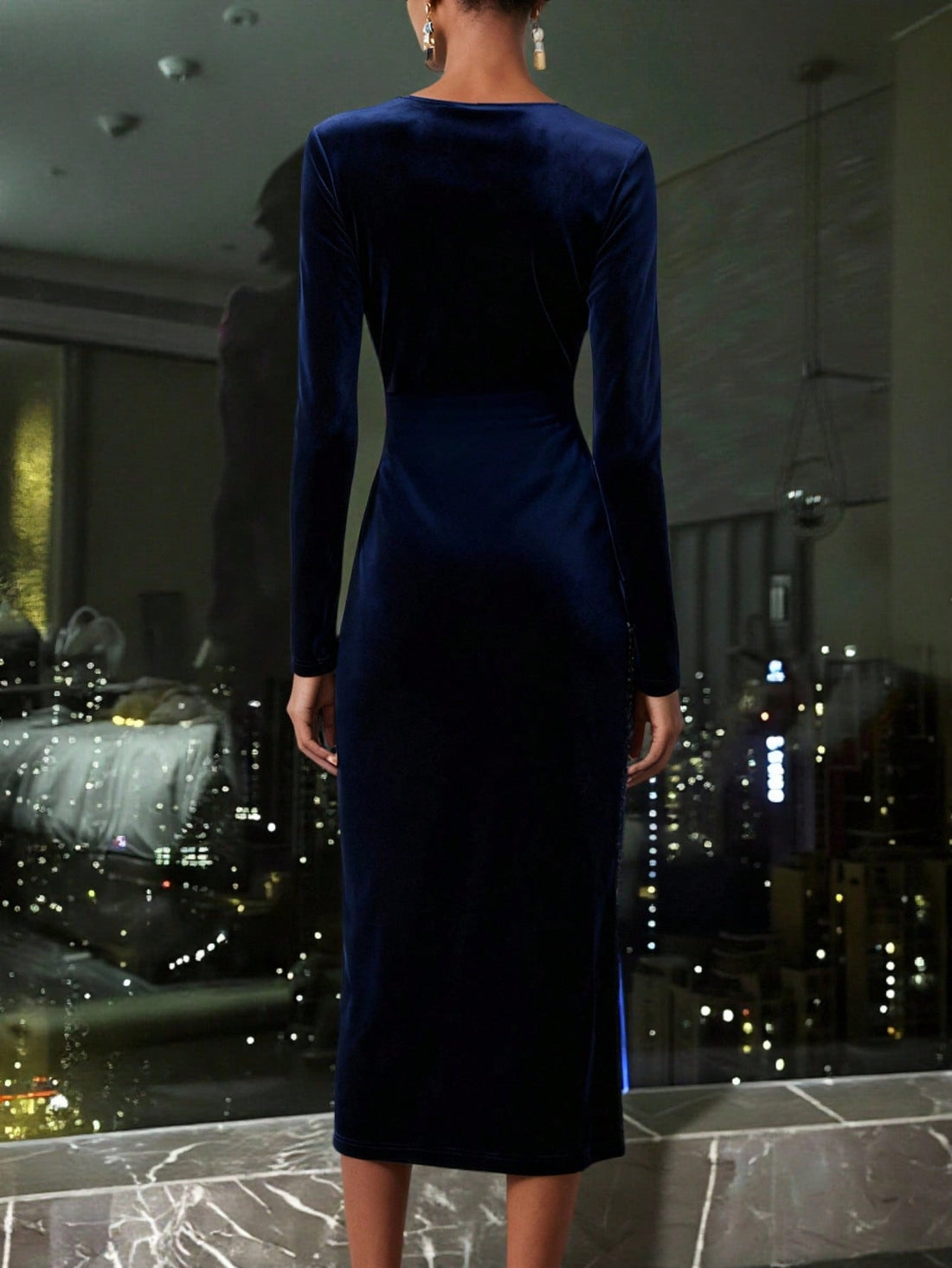 Make a statement at your next event in this stunning navy blue velvet party dress. Luxurious ruching creates flattering dimension while eye-catching sequin patchwork details add glamorous sparkle. The daring slit brings modern edge to classic elegance. Perfect for cocktail parties, weddings, or nights out, this dress combines sophistication with playful flair. Slip it on and watch heads turn!