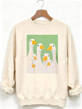 Front view of Adorable Duck Family Print Sweatshirt for All Seasons – Unisex Casual Long Sleeve Pullover Top in Apricot color
