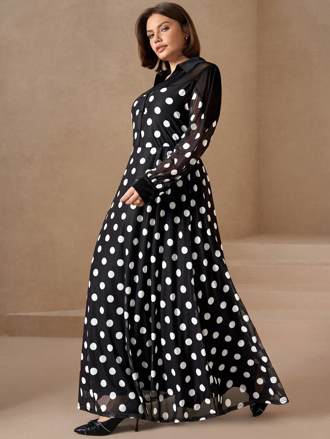 Make a statement in this charming plus-size dress that effortlessly transitions from brunch to evening plans! The timeless black and white polka dot pattern brings a touch of retro flair, while the long sleeves offer elegant coverage and versatility. Flattering cut designed to celebrate your curves with confidence. Perfect for date nights, office events, or whenever you want to feel fabulous and put-together. A wardrobe essential that proves polka dots never go out of style!
