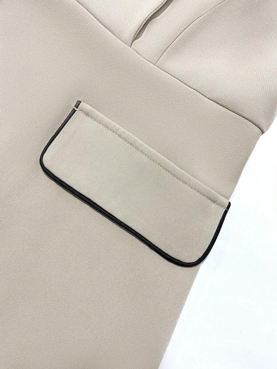 Flap Pocket Close-Up of ivory blazer-style midi dress with black piping for formal work styling