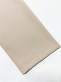 Sleeve Cuff Close-Up of ivory blazer-style midi dress with black piping for formal work styling