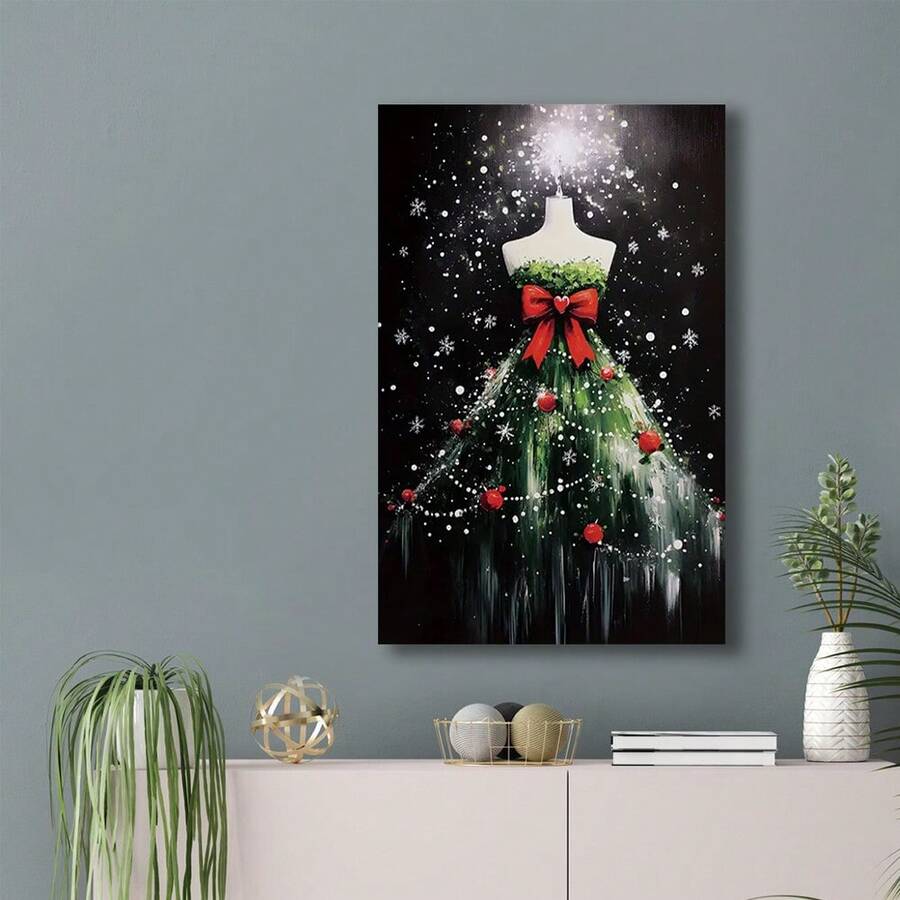 Holiday canvas wall art featuring a snowy green tree dress and red ornaments, displayed over a cabinet on a blue-gray wall