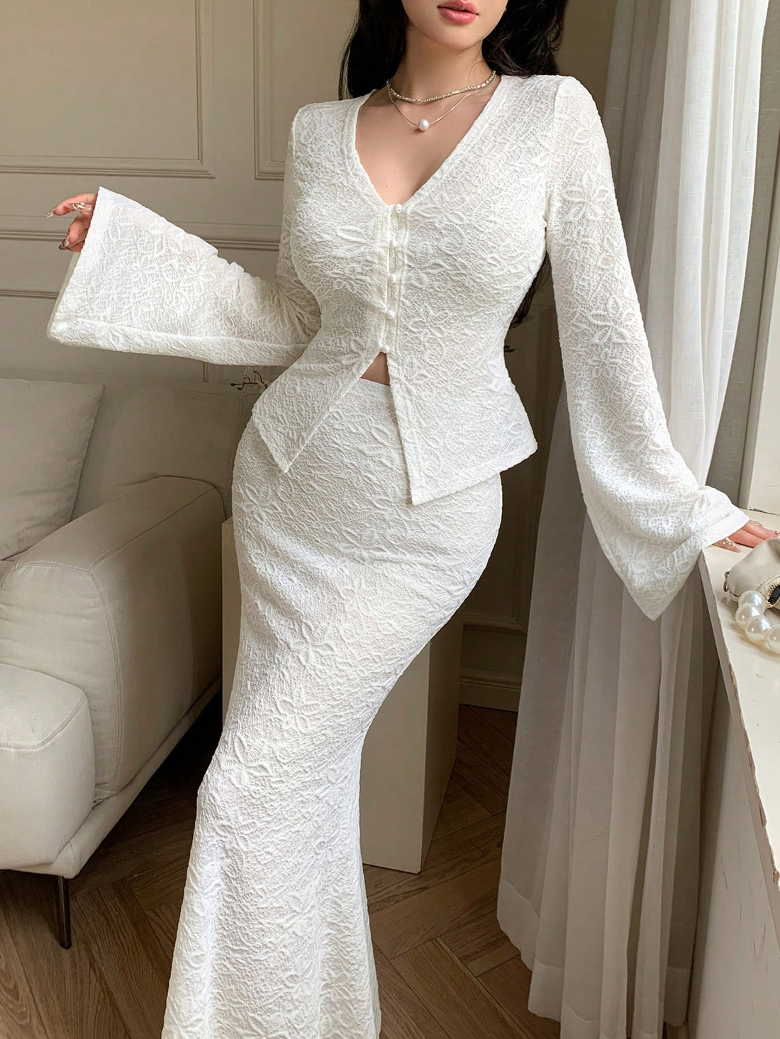 Elevate your wardrobe with this stunning 2-piece white jacquard set that's basically your new best friend! The V-neck top features charming flared sleeves that add just the right amount of flair, while the jacquard texture brings sophisticated elegance to every moment. Whether you're dressing up for a special event or keeping it casual with your favorite jeans, this versatile set delivers timeless style with a playful twist. Perfect for anyone who refuses to choose between comfort and looking absolutely fab