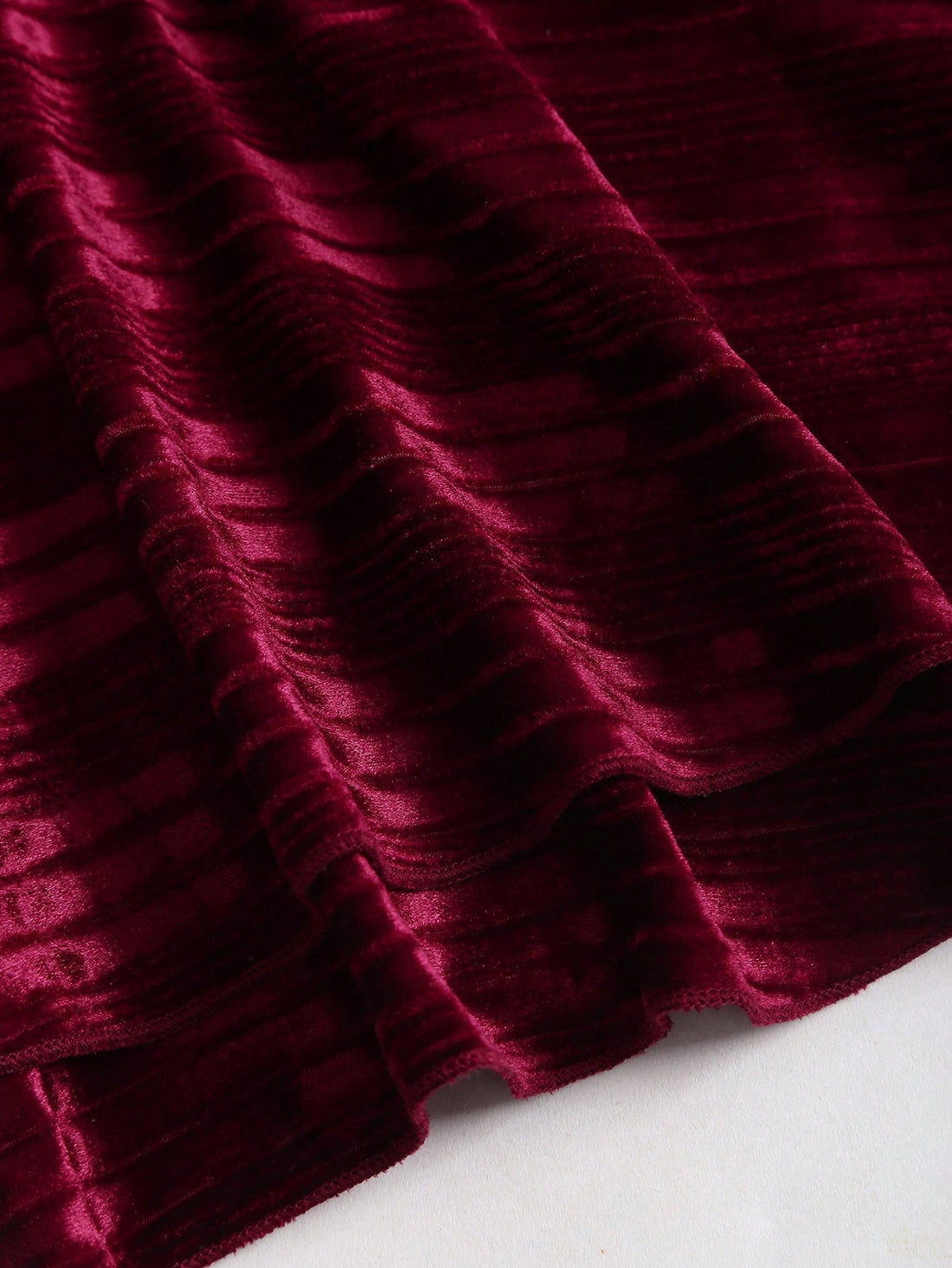 Step into the spotlight this holiday season in our stunning burgundy velvet halter dress. The luxurious velvet fabric drapes beautifully, while the flattering halter neckline frames your shoulders with elegance. Layered skirt details add movement and dimension, creating a show-stopping silhouette perfect for Christmas parties and New Year's Eve celebrations. Whether you're dancing the night away or making a grand entrance, this dress delivers sophistication with a touch of festive flair. Dress it up with he