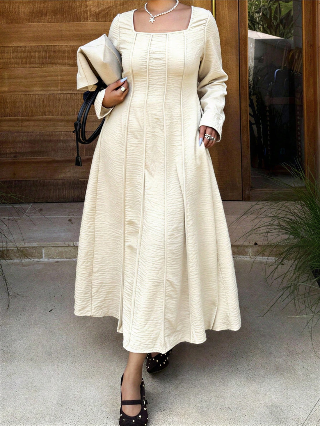 Elevate your everyday style with this fabulous plus-size dress that's equal parts comfort and sophistication. The chic square neckline frames your face beautifully, while long sleeves provide that perfect coverage for any season. Crafted in a timeless solid color, this versatile piece transitions seamlessly from casual coffee dates to dinner with friends. The relaxed fit celebrates your curves with confidence, making you feel amazing no matter where the day takes you. Simple, stunning, and unapologetically 