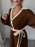 Back view of brown and cream rib-knit A-line midi dress with high waist and long bishop sleeves