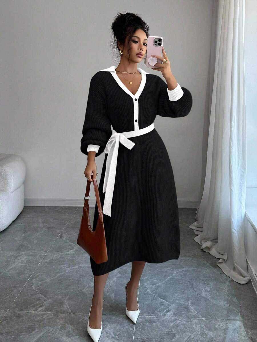 Close view of cream and black button-front sweater midi dress with V-shaped polo collar and tied knit belt