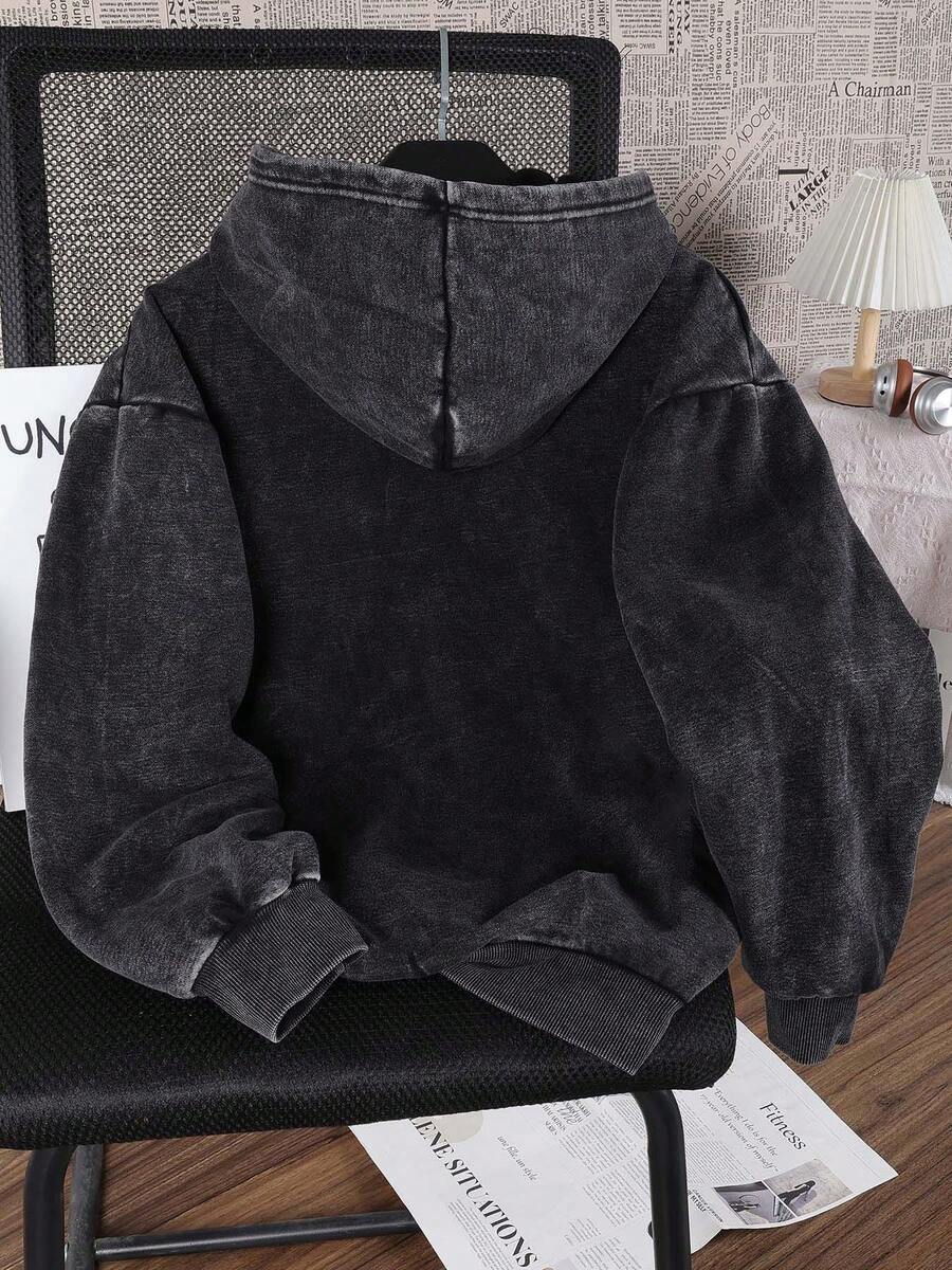 Front hanger view of washed black Medusa graphic pullover hoodie