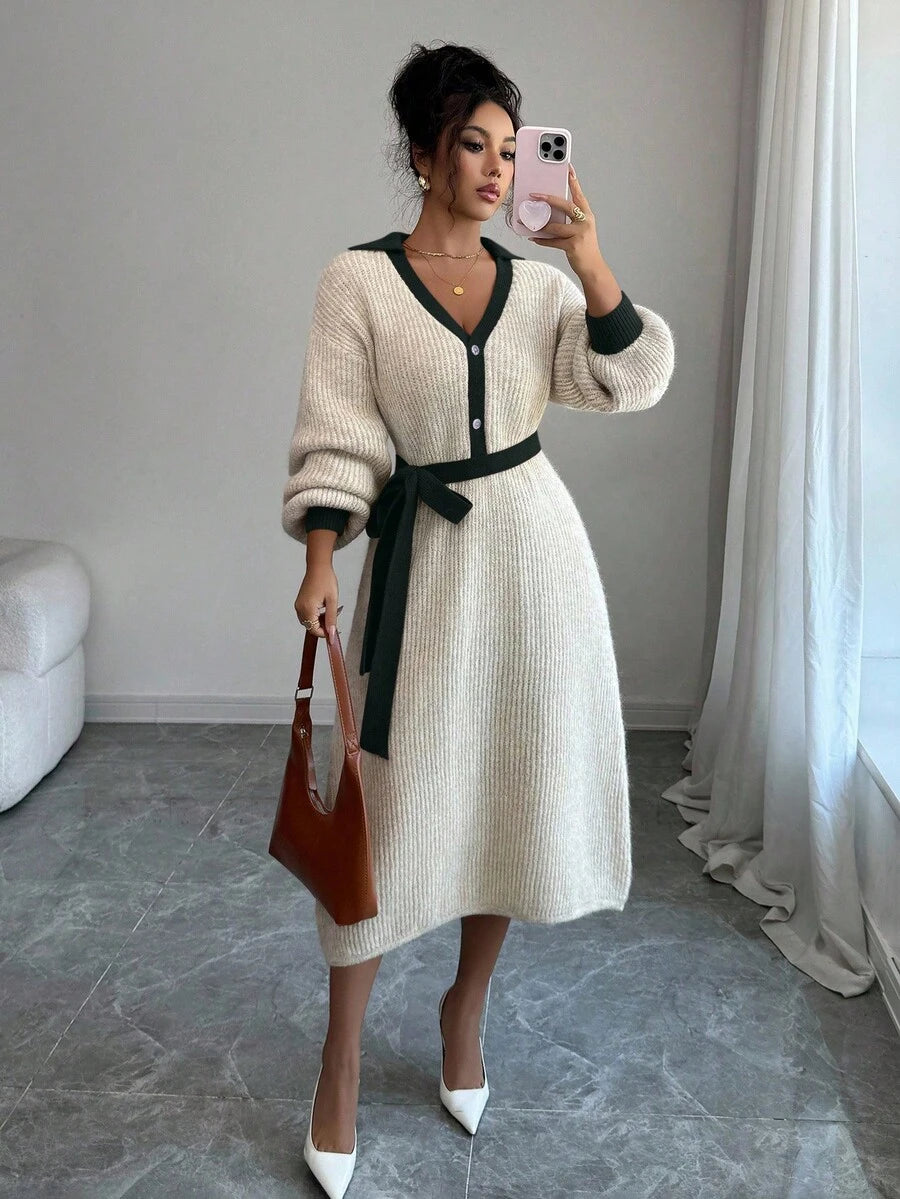 Front view of cream and navy belted polo collar knit midi dress with bishop sleeves and button front