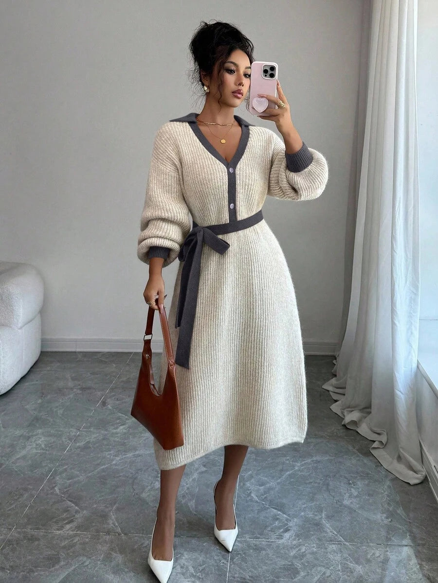 Close view of brown and cream button-front sweater midi dress with V-shaped polo collar and tied knit belt