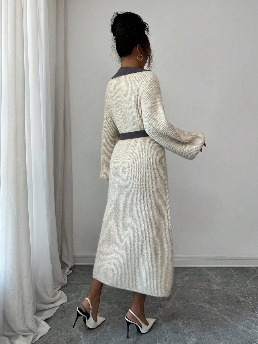 Front view of cream and grey belted polo collar knit midi dress with bishop sleeves and button front