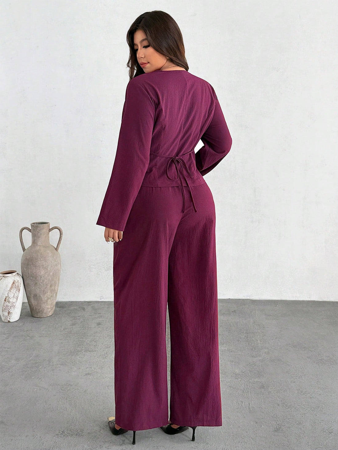 Elevate your work wardrobe with this chic two-piece suit designed for the modern professional! The flattering V-neck cut and thoughtful button details create a polished look that transitions seamlessly from the office to your commute. Crafted in plus sizes, this casual yet sophisticated ensemble celebrates your style while keeping comfort front and center. Whether you're heading to meetings or grabbing coffee, you'll feel confident and put-together in this versatile staple that proves business casual never 