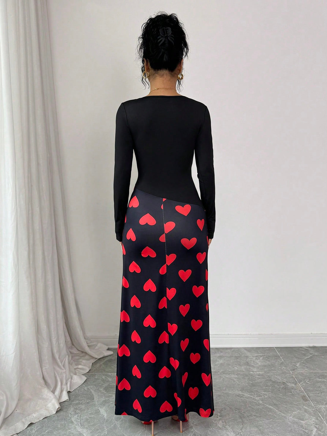 Make a statement this Valentine's Day in our stunning Black Heart Print Colorblock Maxi Dress. Featuring an eye-catching heart print paired with bold colorblocking and a flattering oblique V-neckline, this dress effortlessly transitions from romantic dinners to special celebrations. The flowing maxi silhouette offers comfort and elegance, while the playful design keeps things fun and flirty. Perfect for anyone ready to wear their heart on their sleeve—literally!