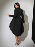 Back view of black long-sleeve high-low hem blazer mini dress for evening styling