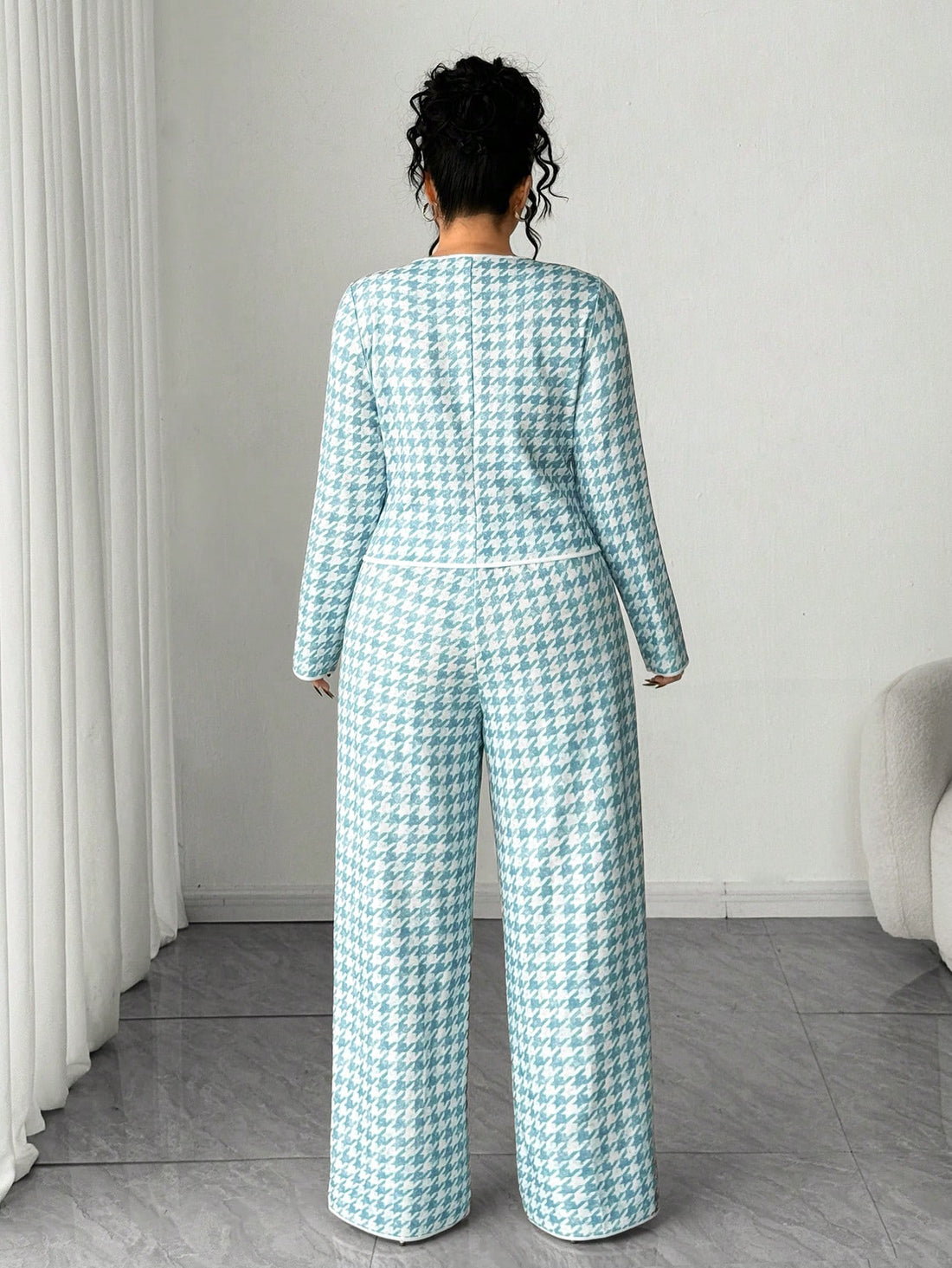 Elevate your winter wardrobe with this chic houndstooth two-piece set! Featuring a tailored cardigan paired with matching pants, this ensemble delivers timeless style with a modern twist. The classic houndstooth pattern works beautifully for layering or wearing as a complete look, making it perfect for everything from office meetings to weekend brunches. Designed with plus-size comfort in mind, the relaxed fit ensures you'll feel confident and fabulous all season long. Mix, match, or wear together—this vers