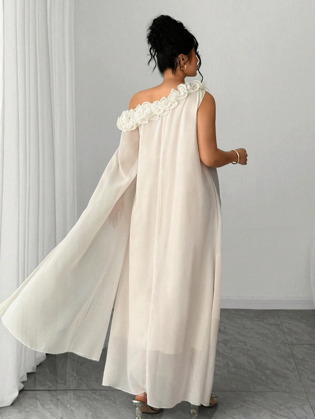 Slip into effortless sophistication with this stunning one-sleeve midi dress that's ready to turn heads at any event. The graceful ruffle design adds movement and dimension, while the asymmetrical neckline creates an instantly chic silhouette. Whether you're heading to a wedding, date night, or special celebration, this versatile piece transitions seamlessly from day to evening. The midi length offers timeless elegance with a modern twist that flatters every figure. Dress it up with heels and statement jewe