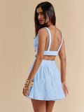 Back view light blue mini dress with open back elastic straps and cutout waist