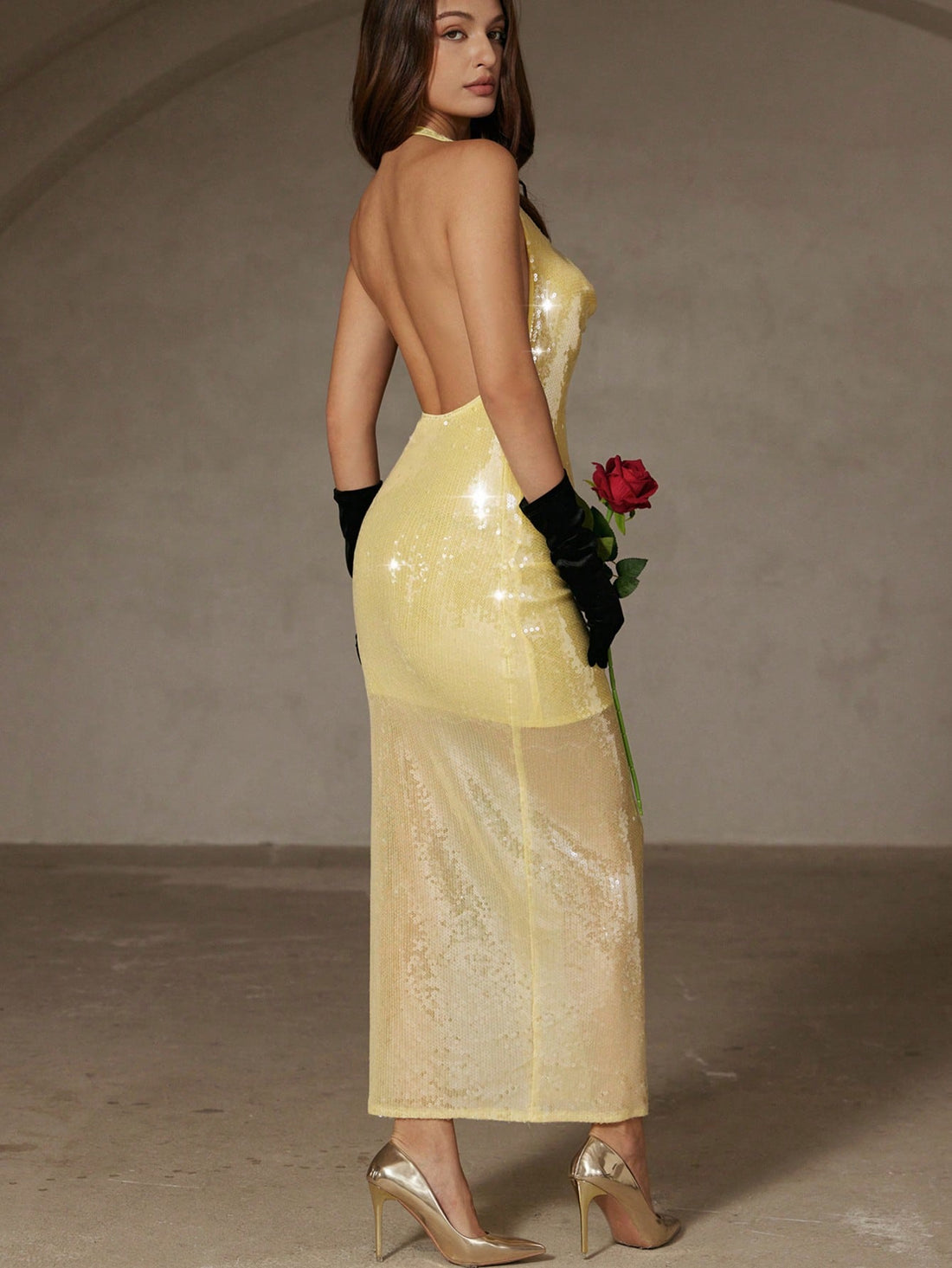 Make a statement in this stunning yellow beaded halter dress that's pure sophistication with a flirty twist. The intricate beadwork catches the light beautifully, while the backless design and bodycon silhouette create an unforgettable look for formal events and parties. Perfect for anyone ready to turn heads and feel absolutely fabulous. Whether you're hitting the dance floor or making a grand entrance, this dress delivers elegance with an edge that says you're confident, bold, and ready to shine.