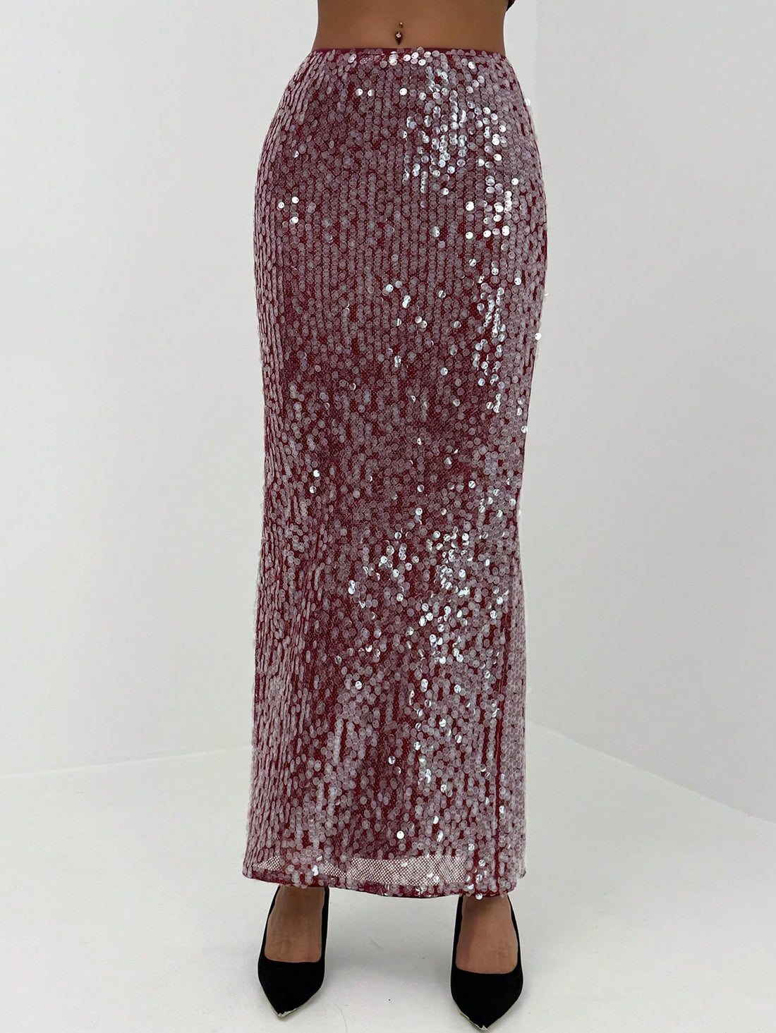 Turn heads at every holiday celebration in this dazzling red sequin mini skirt! Perfect for Christmas parties, New Year's Eve bashes, and festive gatherings, this eye-catching piece delivers instant glamour and fun. The shimmering sequins catch the light with every move, creating a mesmerizing sparkle that keeps the spotlight on you. Pair it with your favorite top and heels for a show-stopping look that says you're ready to celebrate in style. Whether you're dancing till midnight or mingling with friends, t