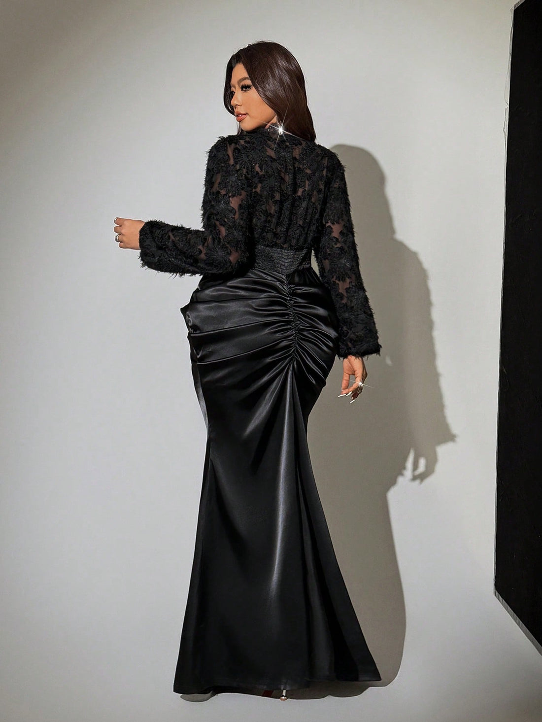 Slip into sophistication with this stunning plus-size fishtail dress that hugs your curves in all the right ways. The long sleeves provide elegant coverage while the ruched detailing creates a flattering silhouette that celebrates your figure. Whether you're heading to a night out, special event, or want to feel fabulous just because, this dress delivers show-stopping style with undeniable sass. The fishtail hem adds a touch of drama and movement, making every step feel like a moment. Comfort meets confiden