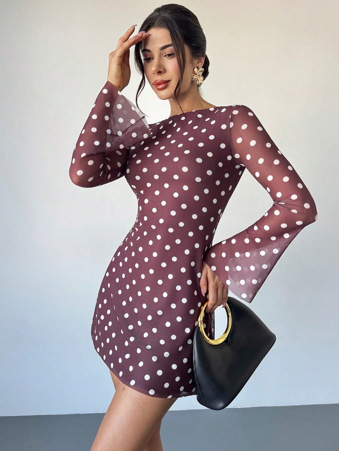 Step into timeless style with this charming polka dot mesh mini dress that effortlessly transitions from casual hangouts to special occasions. The vintage-inspired design features delicate polka dots on sheer mesh fabric, creating a flirty silhouette that flatters every figure. Whether you're heading out on a date, dancing at a party, or keeping it chic for everyday adventures, this versatile piece pairs beautifully with sneakers, heels, or boots. The playful pattern and flattering cut make it an instant wa