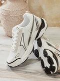 Side and outsole view of white chunky sneakers showing black wave-pattern tread