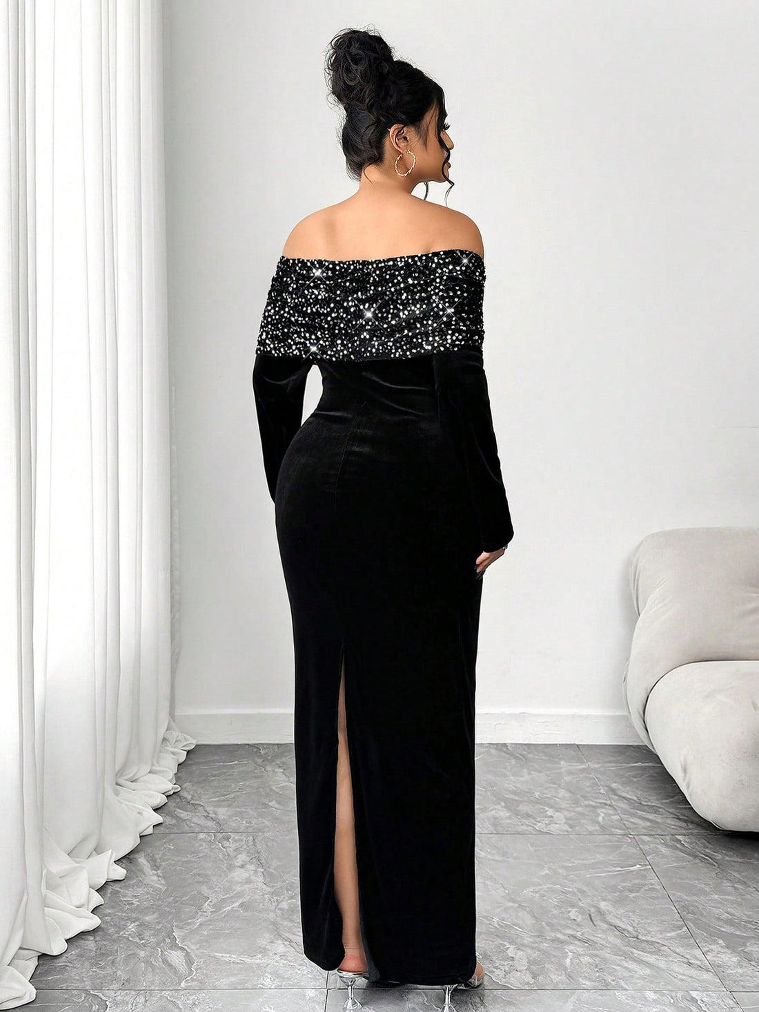 Make a statement in this stunning black velvet maxi dress that's all about glamour and confidence. The off-shoulder neckline shows just the right amount of skin, while cascading sequins catch the light with every move—perfect for turning heads at galas, weddings, or any formal affair. Crafted in luxurious velvet with a flattering plus-size fit, this dress hugs your curves beautifully and flows elegantly to the floor. Whether you're dancing the night away or making a grand entrance, you'll feel absolutely fa