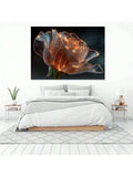 Glowing botanical rose canvas print above white bed