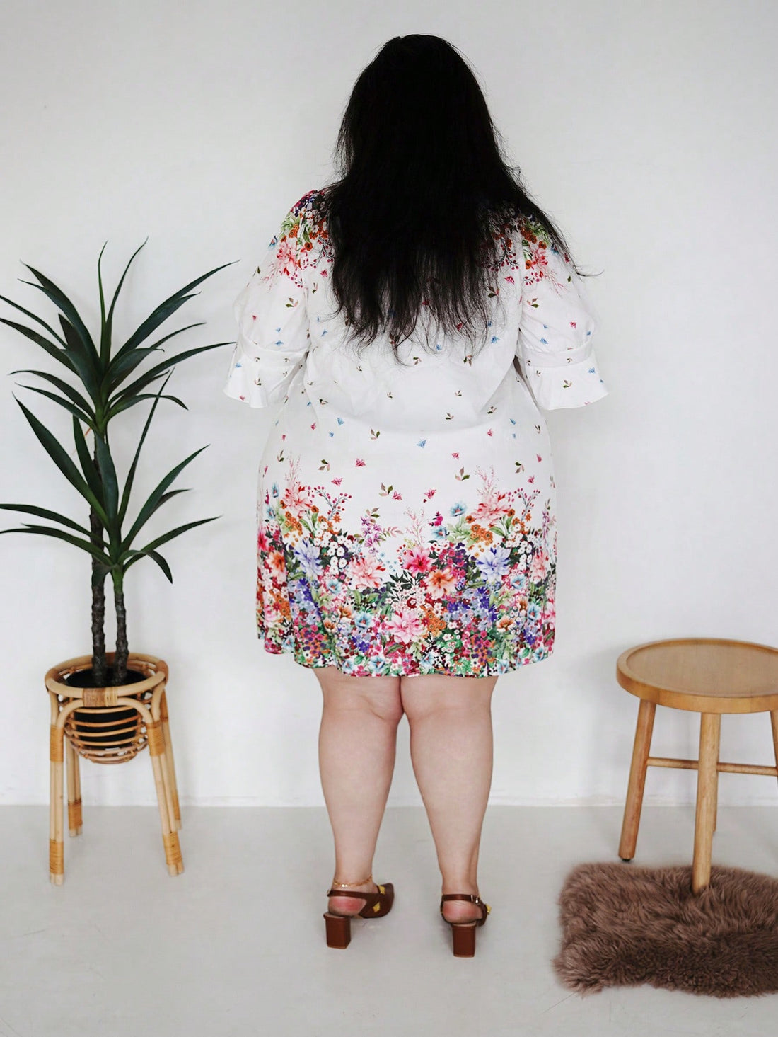 Embrace your curves in this charming floral V-neck dress that's equal parts romantic and effortlessly wearable. The soft, flowing fabric drapes beautifully while the classic V-neckline adds a touch of elegance to your everyday look. Whether you're heading to a holiday gathering or packing for a getaway, this versatile piece transitions seamlessly from casual brunch to evening plans. The vibrant floral print brings joy to any wardrobe, while the generous plus-size fit ensures you feel confident and comfortab