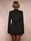 tailored blazer mini dress in burgundy, black and cream with deep V notched lapels, long sleeves, structured shoulders, three gold buttons, cinched waist, back tie, front draped mini skirt and side ruching slit image 5