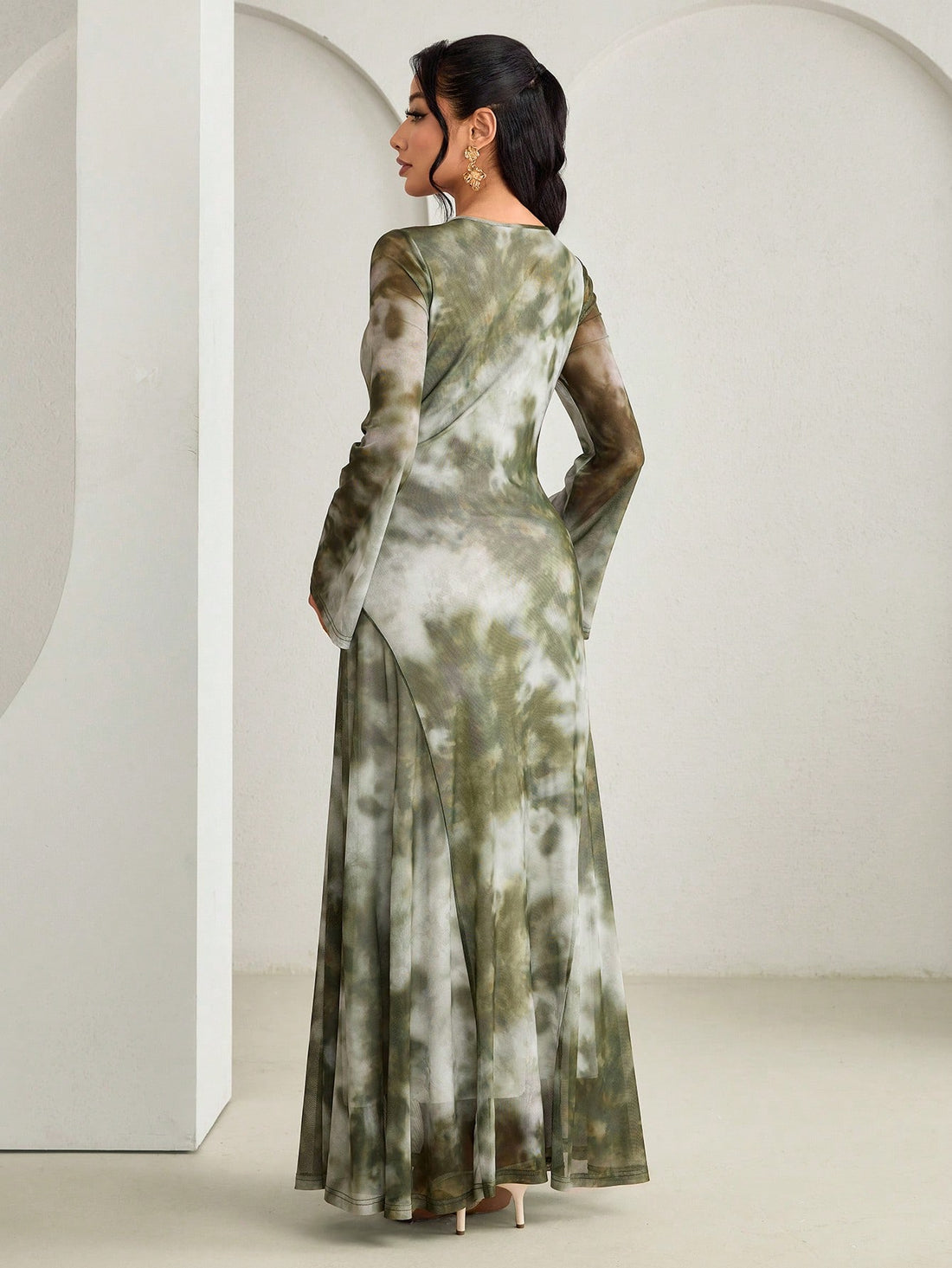 Twirl into vibrant style with this stunning tie dye dress that's equal parts bohemian and bold. Flare sleeves add a dramatic flair while delicate metal accents catch the light with every movement. The mesmerizing tie dye pattern brings artistic energy to your wardrobe, perfect for making a statement at any occasion. Inspired by elegant Arabic fashion, this piece celebrates cultural beauty with modern flair. Comfortable, eye-catching, and undeniably chic—your new favorite dress awaits.