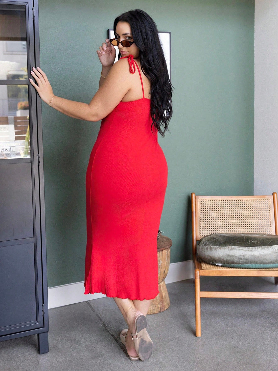 Slip into effortless sophistication with this plus-size bodycon dress that celebrates your curves in all the right ways. The sleek solid color keeps things timeless, while the front tie detail adds a flirty touch that's totally Instagram-worthy. Crafted for comfort and confidence, this camisole-style dress transitions seamlessly from brunch dates to evening hangouts. Whether you're dressing it up with heels or keeping it casual with sneakers, you'll feel fabulous every single time you wear it.