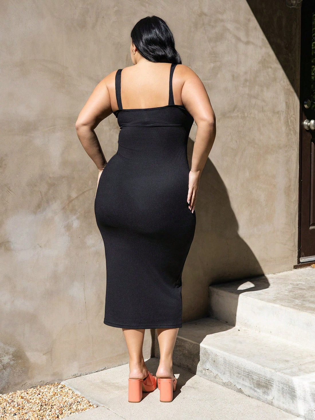 Designed with pear-shaped curves in mind, this plus-size suspender dress features charming button details that add personality to your wardrobe. The structured silhouette flatters your figure while the adjustable suspenders provide a custom fit that moves with you. Perfect for dressing up or down, this versatile piece transitions seamlessly from casual outings to special occasions. Embrace your shape with confidence in a dress that celebrates your unique style.