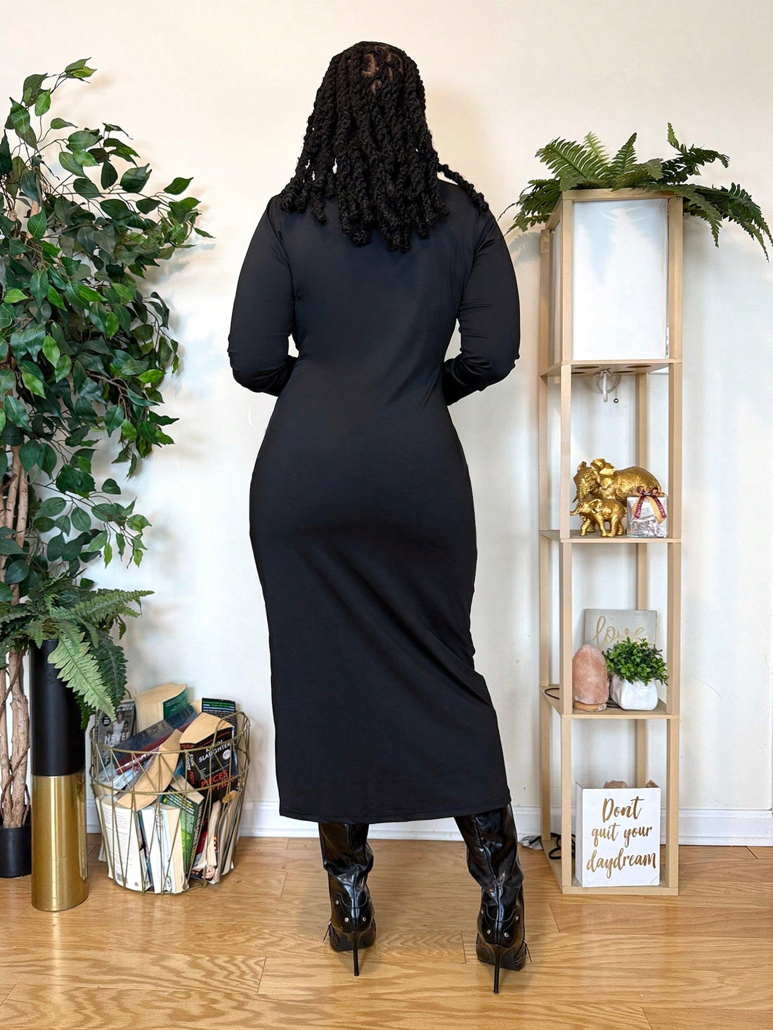 Embrace your curves with confidence in this chic black bodycon midi dress, expertly designed for pear-shaped figures. The long sleeves provide warmth and coverage while the fitted silhouette celebrates your natural shape. Perfect for casual hangouts or party nights, this versatile piece transitions seamlessly from day to evening. The midi length offers a sophisticated touch without compromising comfort. Available in plus sizes, it's the dress that finally gets you—flattering where it counts and fabulous all