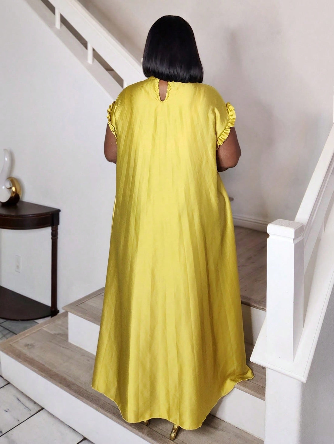 Elevate your wardrobe with this stunning ruffle sleeve dress that effortlessly transitions from brunch to evening events. The delicate ruffled sleeves add a touch of whimsy and romance, while the flattering silhouette ensures you'll feel confident and fabulous no matter where the day takes you. Crafted for the modern woman who refuses to compromise on style, this versatile piece is your new go-to for looking polished and put-together. Whether you're dressing up for a special occasion or keeping it casual-ch