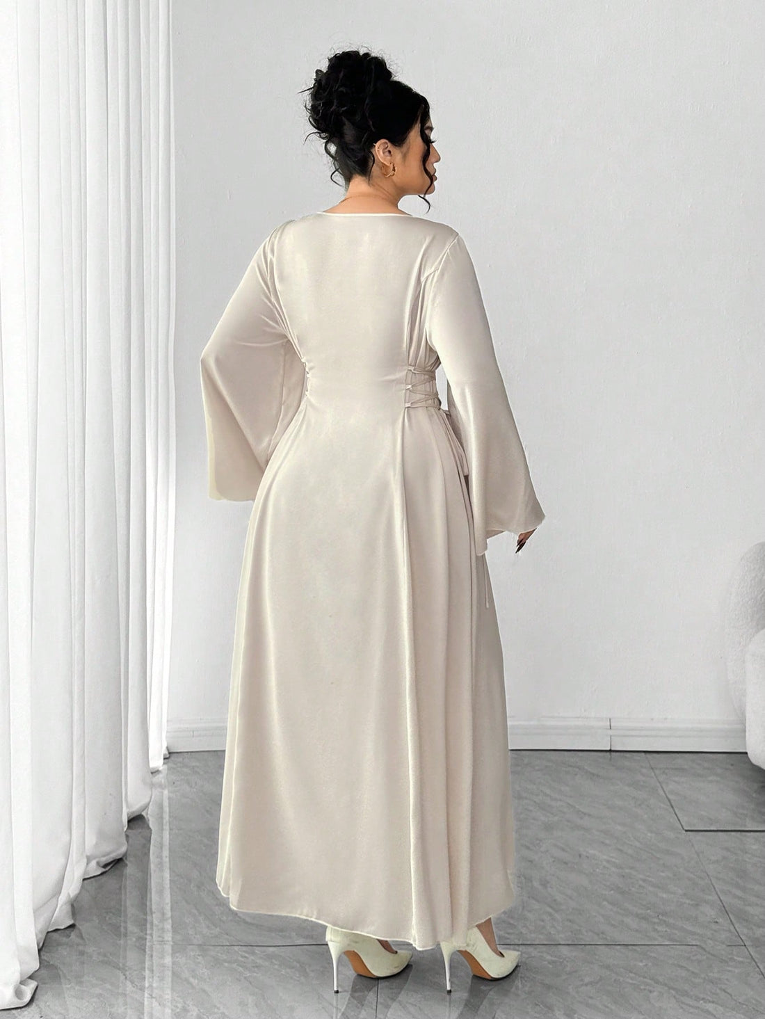 Shine bright like the sequin-studded star you are! This plus-size dress combines elegance with a touch of glamour, featuring intricate sequin embroidery that catches the light beautifully. The flattering V-neckline and flowy flare sleeves create a silhouette that's both sophisticated and fun. Perfect for evening events, parties, or whenever you want to feel absolutely fabulous. Slip into confidence and let your sparkle do the talking!