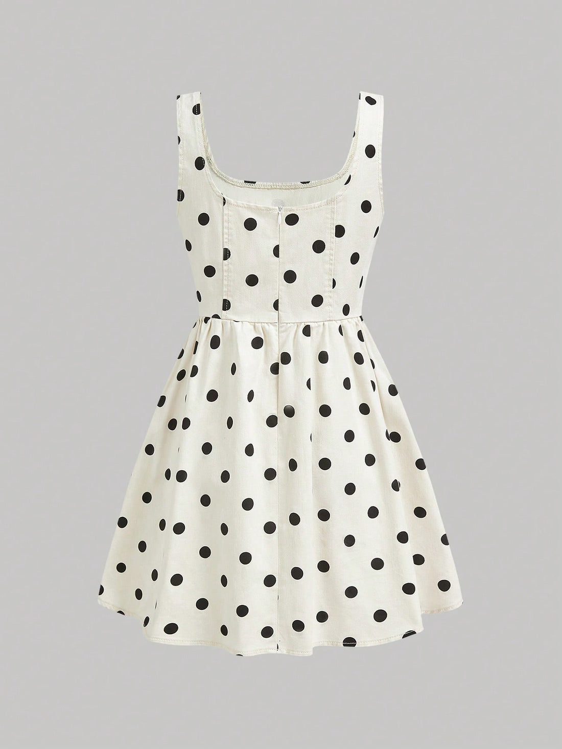Rock a timeless look with this sleeveless denim dress featuring charming polka dots. Perfect for casual outings or dressed-up occasions, this versatile piece pairs effortlessly with sneakers, sandals, or heels. The classic denim fabric offers durability and comfort, while the playful dot pattern adds a fun twist to your everyday wardrobe. Whether you're running errands or heading out for brunch, this dress is your go-to for laid-back style that never goes out of fashion.