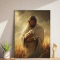 Close view of portrait canvas art depicting Jesus gently holding a lamb against a warm cloudy sky, styled on a bright wall